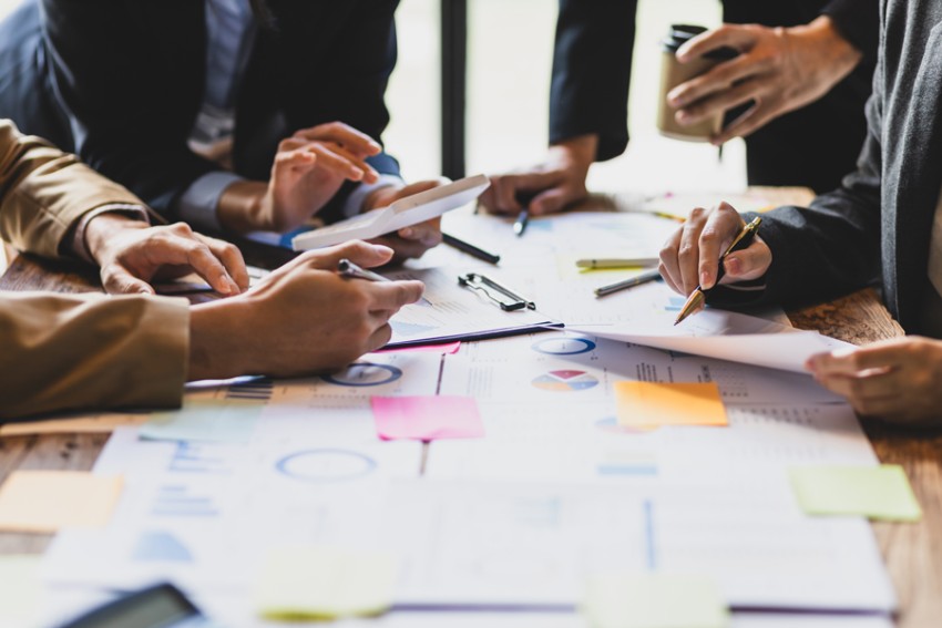 group of people working around a table